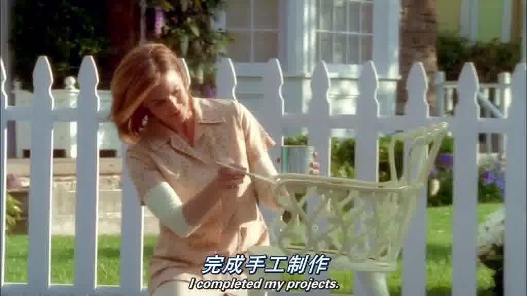 She is painting a garden chair.jpg