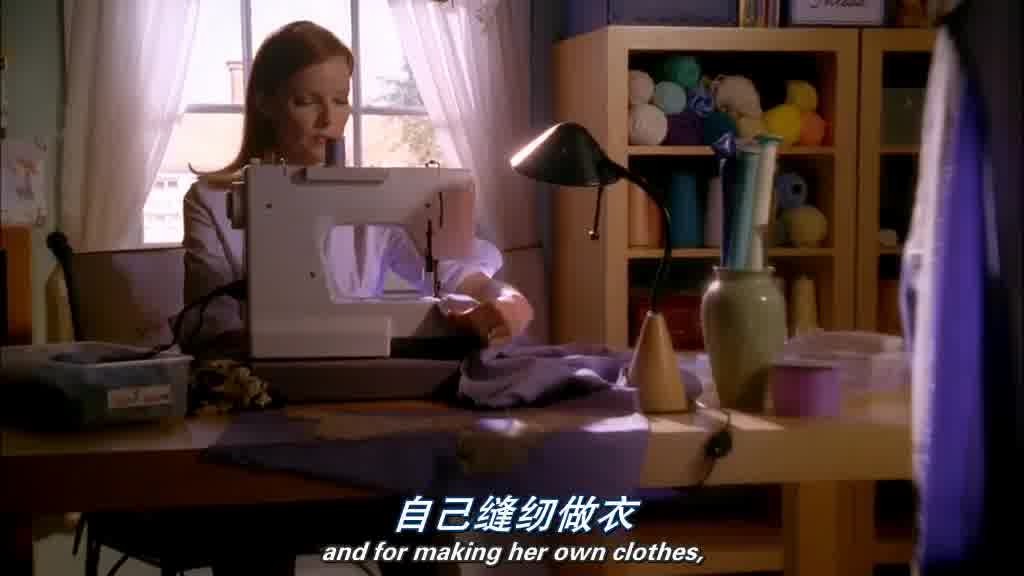 BREE, sitting at a sewing machine, making clothes.jpg