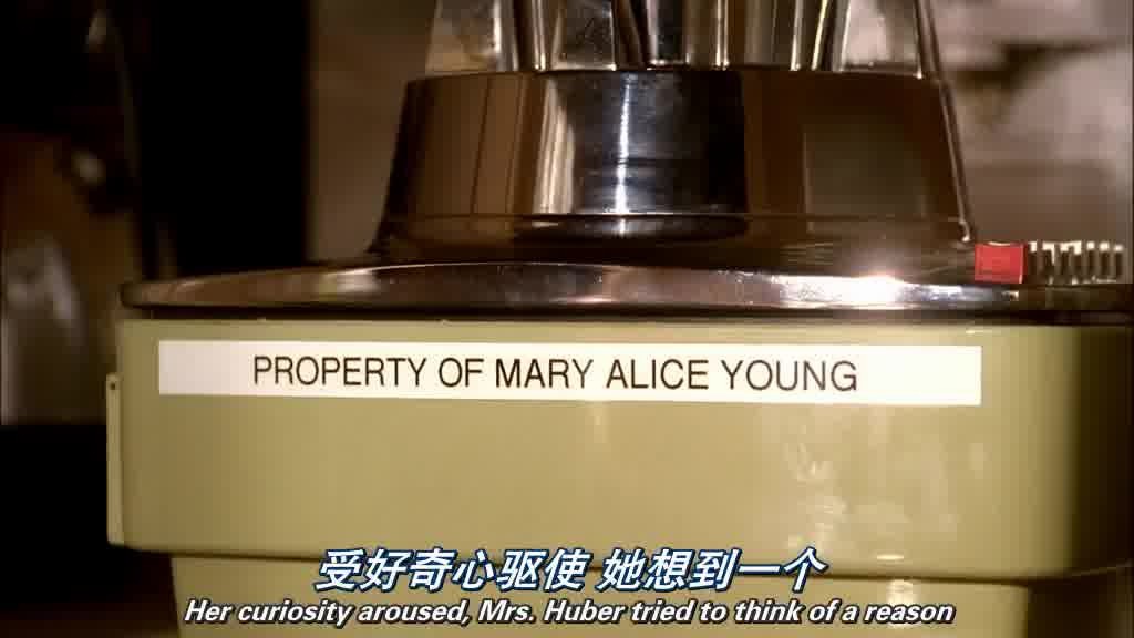 MRS. HUBER takes a blender labeled Property of MARY ALICE YOUNG off a shelf.jpg