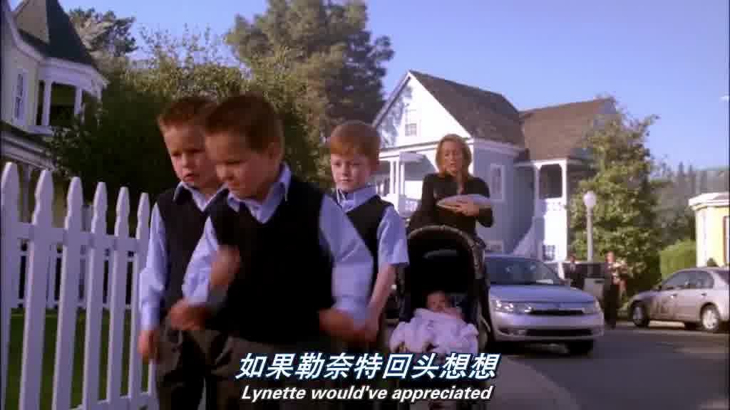 The 3 boys jostle each other as they walk on the sidewalk in front of the carria.jpg