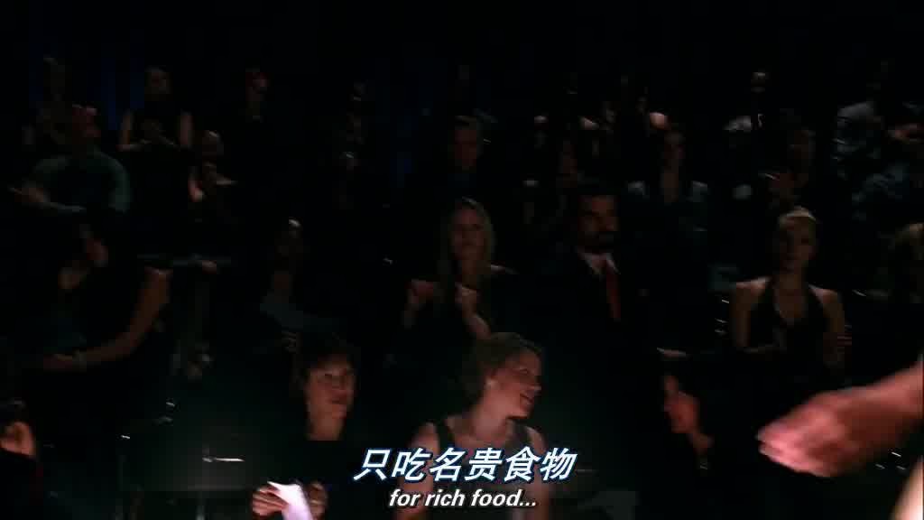 The crowd is clapping and many cameras are flashing.jpg