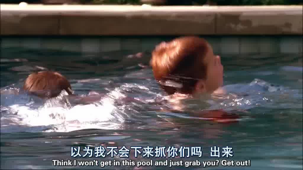 LYNETTE struggles in the pool with the boys, splashing around as the boys try to.jpg