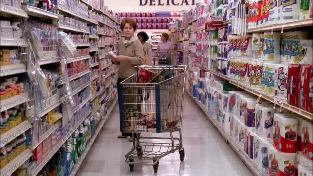 She immediately hurries out, leaving her cart in the middle of the aisle while M.jpg