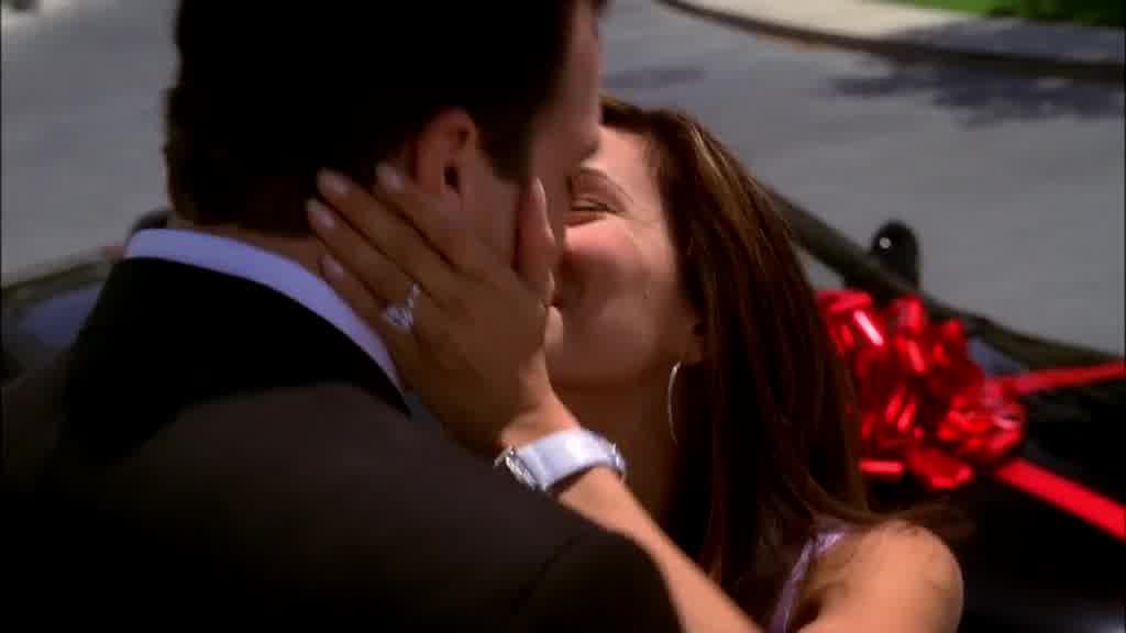 GABRIELLE kisses CARLOS as he picks her up.jpg