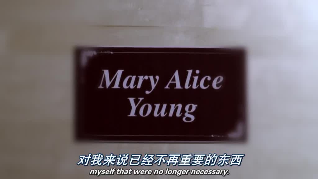 A coffin cover, with a label MARY ALICE YOUNG is slid over the top.jpg