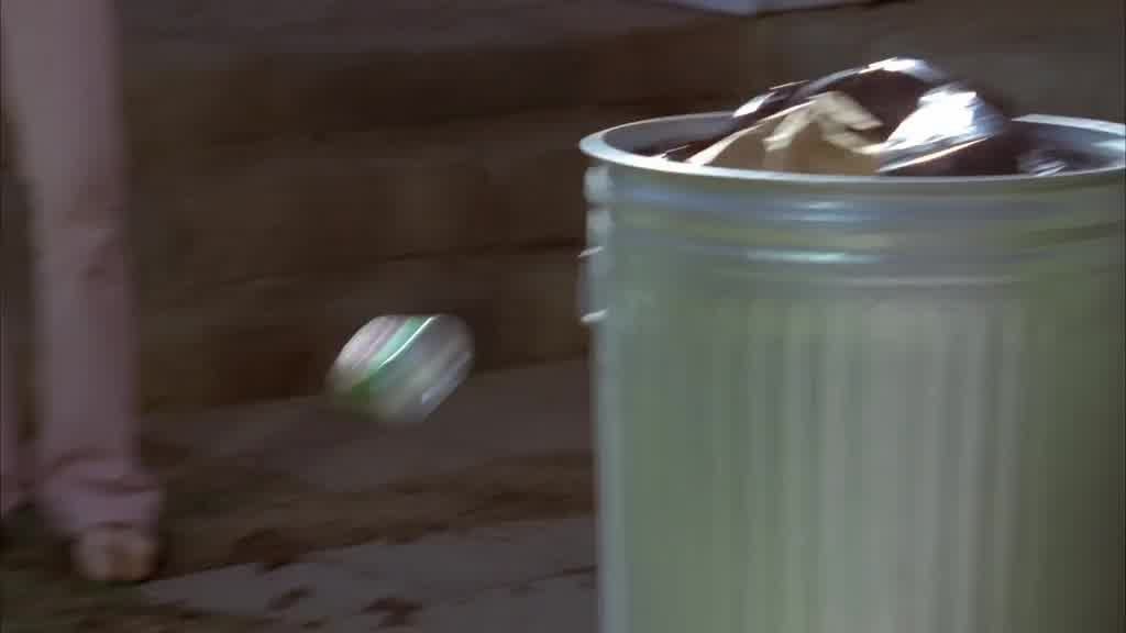 BRANDI throws her drink can towards the rubbish bin.jpg