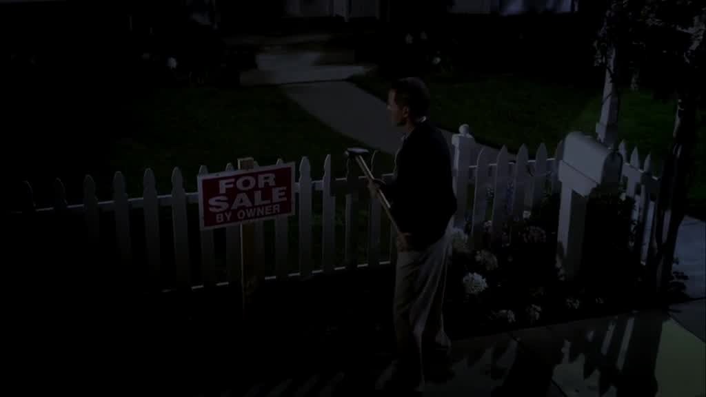 PAUL banging a huge a For Sale By Owner with a hammer into his front yard.jpg