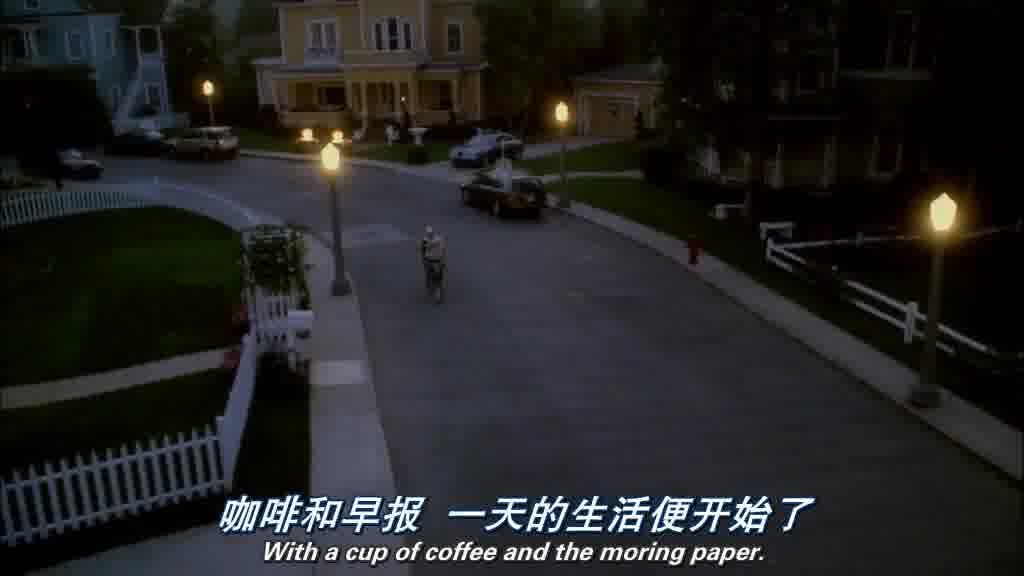 The street lights are still on, and there's a paper boy on a bike, throwing.jpg