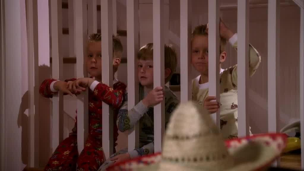 We see the three SCAVO kids sitting on the landing of the stairs, watching their.jpg