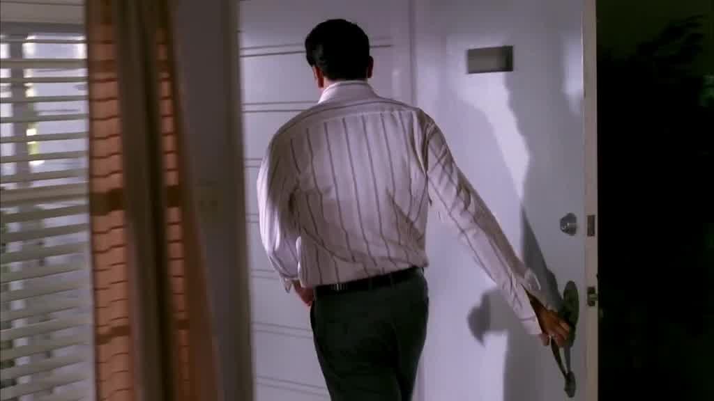 Carlos sets the picture back down and leaves, shutting the door behind him.jpg