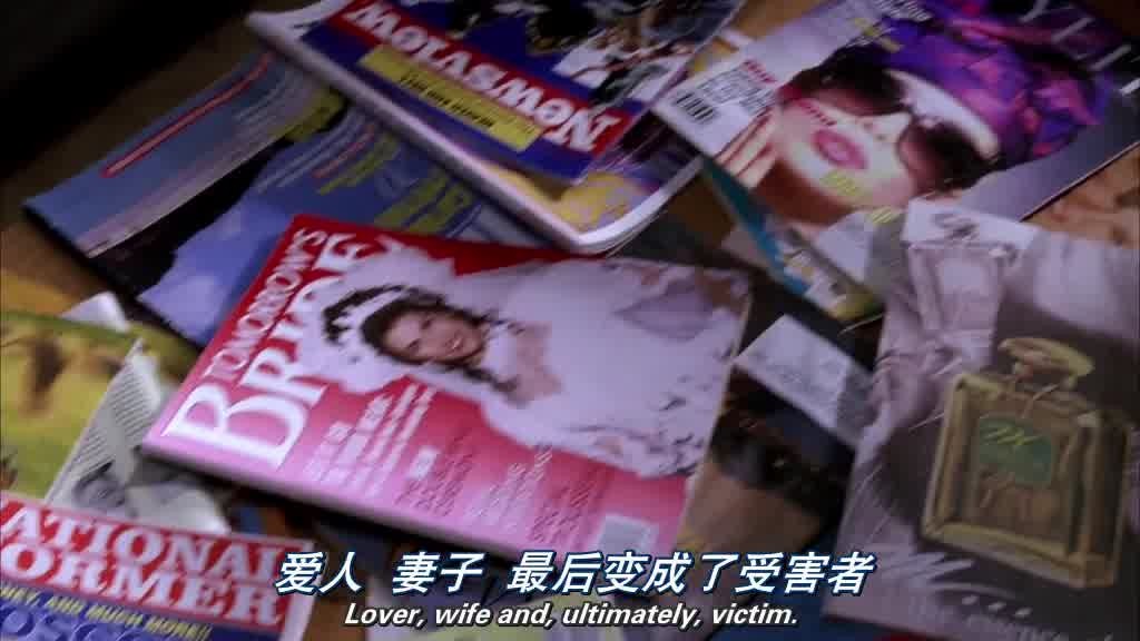 shot pans over a coffee table filled with magazines on a range of different topics.jpg