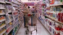 S01E01 She immediately hurries out, leaving her cart in the middle of the aisle while MRS. HUBER is busy browsing