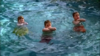 S01E01 The SCAVO kids all float in the water, their arms crossed in defiance