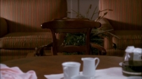 S01E01 SUSAN takes her place at the table, and looks at the one empty chair in the table, where MARY ALICE used to sit