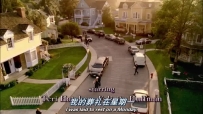 S01E01 Residents wearing black clothing and bearing plates and baskets of food are walking towards the YOUNG household