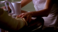 S01E01 SUSAN puts her other hand on top of MARY ALICE's hand, smiling at her