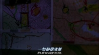 S01E02 The camera pans up to see a few maps stuck to the wall, marked with many drawings and markings